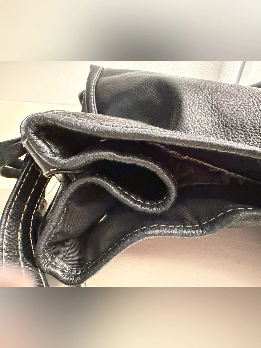 The Sak “PO Asbury” large pebbled black leather hobo/shoulder bag.